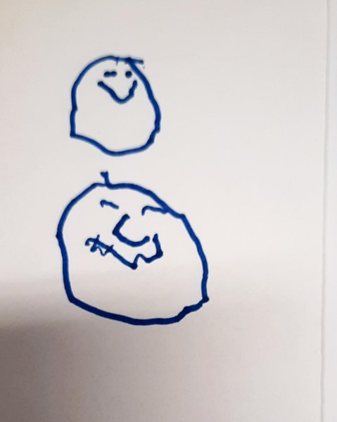 two hand drawn smiling faces. One is above the other and they are drawn in blue pen